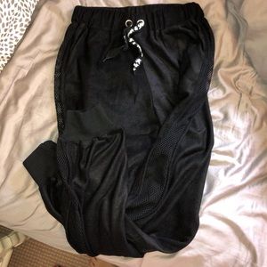 Black joggers with mesh down both sides